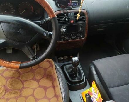 Сірий Міцубісі Харизма, об'ємом двигуна 1.6 л та пробігом 330 тис. км за 2800 $, фото 11 на Automoto.ua