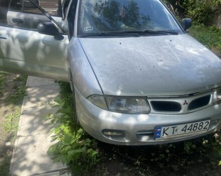 Серый Мицубиси Харизма, объемом двигателя 1.8 л и пробегом 202 тыс. км за 1100 $, фото 1 на Automoto.ua