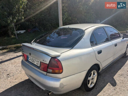 Серый Мицубиси Харизма, объемом двигателя 1.83 л и пробегом 415 тыс. км за 1999 $, фото 1 на Automoto.ua