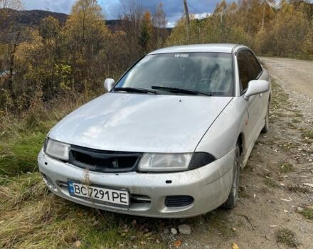 Серый Мицубиси Харизма, объемом двигателя 1.6 л и пробегом 270 тыс. км за 750 $, фото 1 на Automoto.ua