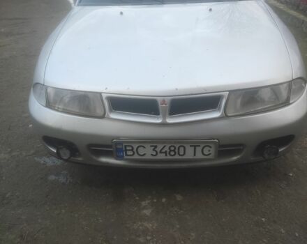 Серый Мицубиси Харизма, объемом двигателя 1.9 л и пробегом 280 тыс. км за 1200 $, фото 1 на Automoto.ua