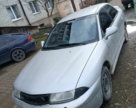 Серый Мицубиси Харизма, объемом двигателя 1.6 л и пробегом 270 тыс. км за 850 $, фото 1 на Automoto.ua