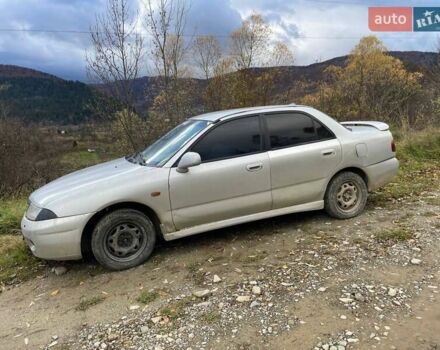 Серый Мицубиси Харизма, объемом двигателя 1.6 л и пробегом 270 тыс. км за 750 $, фото 1 на Automoto.ua