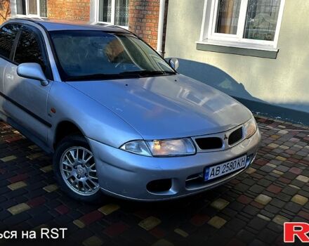 Серый Мицубиси Харизма, объемом двигателя 1.8 л и пробегом 296 тыс. км за 1600 $, фото 1 на Automoto.ua