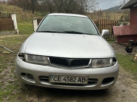 Серый Мицубиси Харизма, объемом двигателя 1.9 л и пробегом 350 тыс. км за 1000 $, фото 1 на Automoto.ua