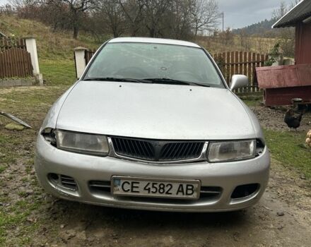 Сірий Міцубісі Харизма, об'ємом двигуна 1.9 л та пробігом 350 тис. км за 1000 $, фото 1 на Automoto.ua