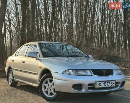 Серый Мицубиси Харизма, объемом двигателя 1.83 л и пробегом 350 тыс. км за 1500 $, фото 1 на Automoto.ua