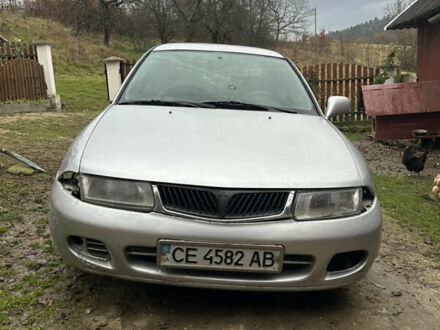 Серый Мицубиси Харизма, объемом двигателя 1.9 л и пробегом 368 тыс. км за 1000 $, фото 1 на Automoto.ua