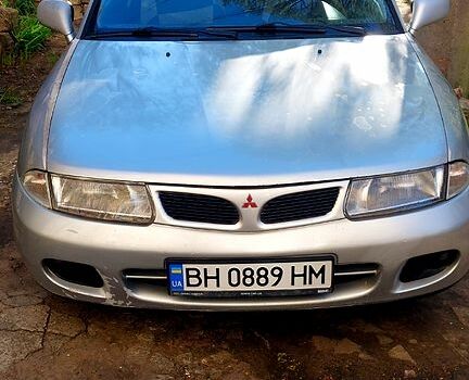 Серый Мицубиси Харизма, объемом двигателя 1.8 л и пробегом 320 тыс. км за 1600 $, фото 1 на Automoto.ua