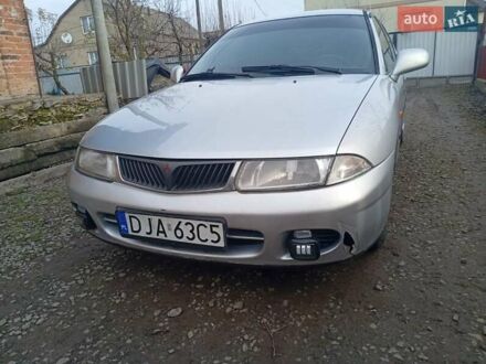 Сірий Міцубісі Харизма, об'ємом двигуна 1.9 л та пробігом 65 тис. км за 1650 $, фото 1 на Automoto.ua