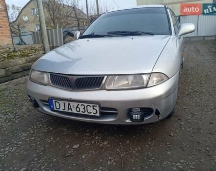 Серый Мицубиси Харизма, объемом двигателя 1.9 л и пробегом 65 тыс. км за 1650 $, фото 1 на Automoto.ua