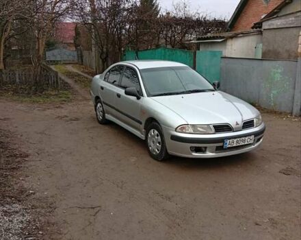 Серый Мицубиси Харизма, объемом двигателя 1.6 л и пробегом 320 тыс. км за 3000 $, фото 1 на Automoto.ua