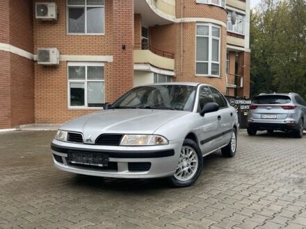 Серый Мицубиси Харизма, объемом двигателя 1.9 л и пробегом 400 тыс. км за 2800 $, фото 1 на Automoto.ua