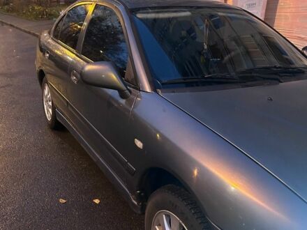 Серый Мицубиси Харизма, объемом двигателя 1.8 л и пробегом 377 тыс. км за 1182 $, фото 1 на Automoto.ua