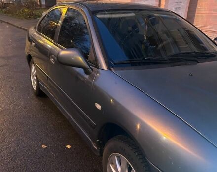 Серый Мицубиси Харизма, объемом двигателя 1.8 л и пробегом 377 тыс. км за 1182 $, фото 1 на Automoto.ua