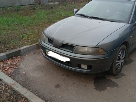 Серый Мицубиси Харизма, объемом двигателя 1.6 л и пробегом 3 тыс. км за 2000 $, фото 1 на Automoto.ua