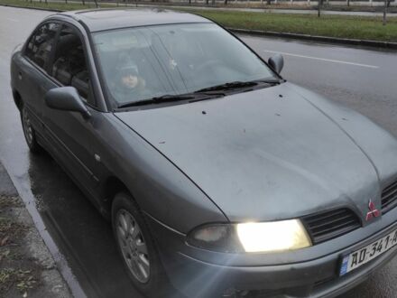 Серый Мицубиси Харизма, объемом двигателя 1.8 л и пробегом 379 тыс. км за 1307 $, фото 1 на Automoto.ua