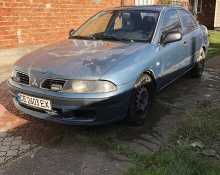 Серый Мицубиси Харизма, объемом двигателя 1.6 л и пробегом 407 тыс. км за 1100 $, фото 1 на Automoto.ua