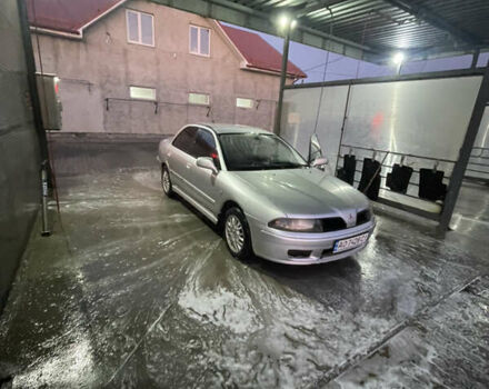 Серый Мицубиси Харизма, объемом двигателя 1.6 л и пробегом 300 тыс. км за 2800 $, фото 1 на Automoto.ua