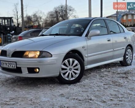 Серый Мицубиси Харизма, объемом двигателя 1.8 л и пробегом 214 тыс. км за 4777 $, фото 1 на Automoto.ua