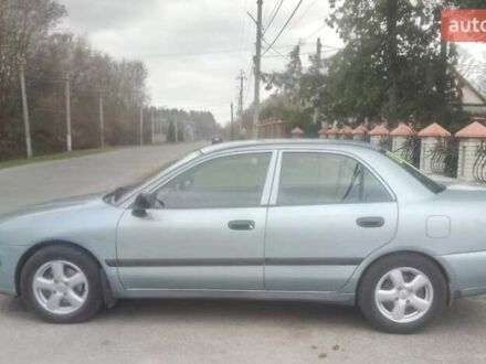 Серый Мицубиси Харизма, объемом двигателя 1.6 л и пробегом 275 тыс. км за 2450 $, фото 1 на Automoto.ua