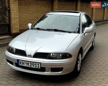 Серый Мицубиси Харизма, объемом двигателя 1.8 л и пробегом 214 тыс. км за 4400 $, фото 1 на Automoto.ua