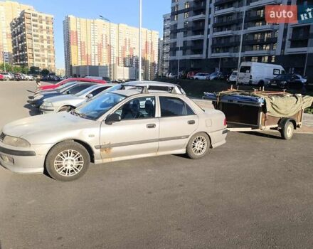 Серый Мицубиси Харизма, объемом двигателя 1.6 л и пробегом 270 тыс. км за 2300 $, фото 1 на Automoto.ua