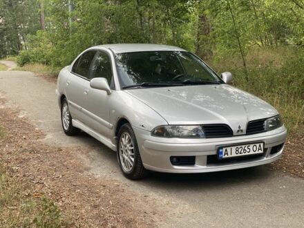 Серый Мицубиси Харизма, объемом двигателя 1.8 л и пробегом 265 тыс. км за 3500 $, фото 1 на Automoto.ua