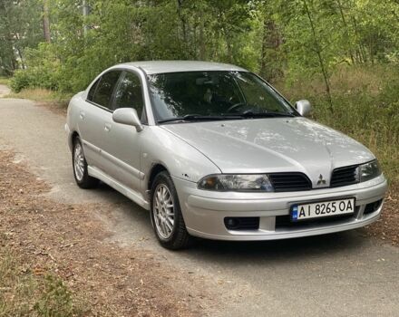 Серый Мицубиси Харизма, объемом двигателя 1.8 л и пробегом 265 тыс. км за 3500 $, фото 1 на Automoto.ua