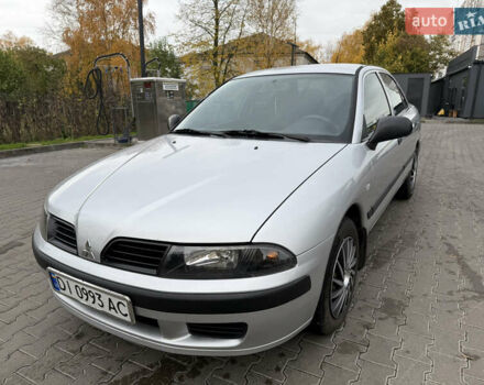 Серый Мицубиси Харизма, объемом двигателя 1.6 л и пробегом 184 тыс. км за 3900 $, фото 1 на Automoto.ua