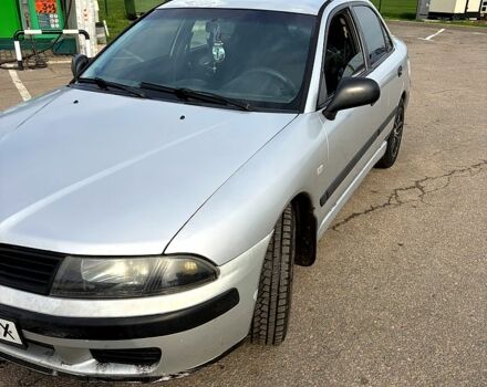 Серый Мицубиси Харизма, объемом двигателя 1.6 л и пробегом 300 тыс. км за 2600 $, фото 1 на Automoto.ua