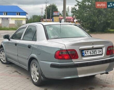 Серый Мицубиси Харизма, объемом двигателя 1.6 л и пробегом 245 тыс. км за 1700 $, фото 1 на Automoto.ua