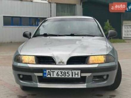 Серый Мицубиси Харизма, объемом двигателя 1.6 л и пробегом 245 тыс. км за 1950 $, фото 1 на Automoto.ua