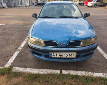 Синий Мицубиси Харизма, объемом двигателя 1.6 л и пробегом 320 тыс. км за 2000 $, фото 1 на Automoto.ua