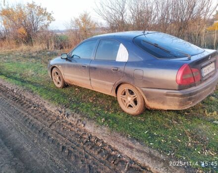 Синий Мицубиси Харизма, объемом двигателя 1.6 л и пробегом 300 тыс. км за 1800 $, фото 1 на Automoto.ua