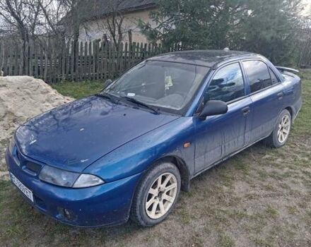 Синий Мицубиси Харизма, объемом двигателя 1.6 л и пробегом 380 тыс. км за 1900 $, фото 1 на Automoto.ua
