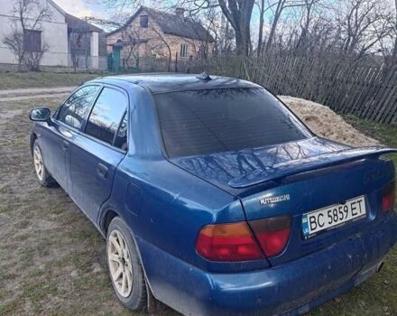 Синий Мицубиси Харизма, объемом двигателя 1.6 л и пробегом 380 тыс. км за 1900 $, фото 4 на Automoto.ua