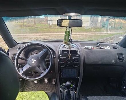 Синий Мицубиси Харизма, объемом двигателя 1.6 л и пробегом 380 тыс. км за 1900 $, фото 7 на Automoto.ua