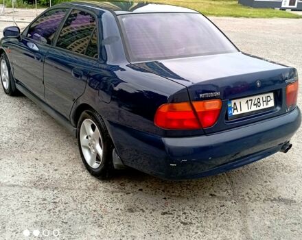 Синий Мицубиси Харизма, объемом двигателя 1.8 л и пробегом 350 тыс. км за 2000 $, фото 1 на Automoto.ua