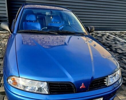 Синий Мицубиси Харизма, объемом двигателя 1.8 л и пробегом 305 тыс. км за 3999 $, фото 1 на Automoto.ua