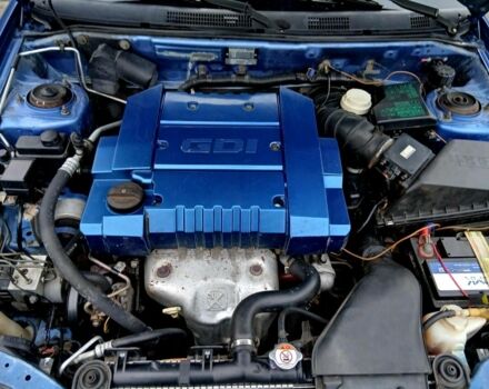 Синий Мицубиси Харизма, объемом двигателя 1.8 л и пробегом 305 тыс. км за 3999 $, фото 4 на Automoto.ua