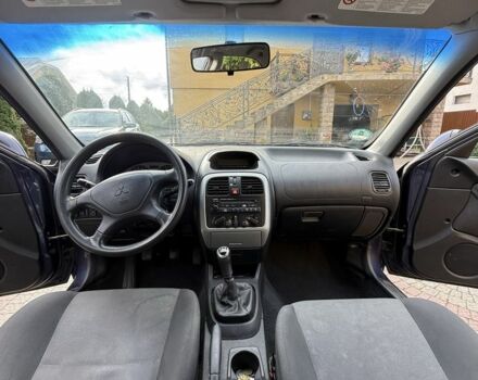 Синий Мицубиси Харизма, объемом двигателя 1.8 л и пробегом 275 тыс. км за 3000 $, фото 5 на Automoto.ua