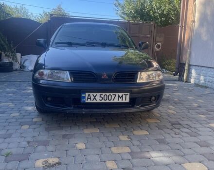 Синий Мицубиси Харизма, объемом двигателя 1.8 л и пробегом 250 тыс. км за 3000 $, фото 4 на Automoto.ua