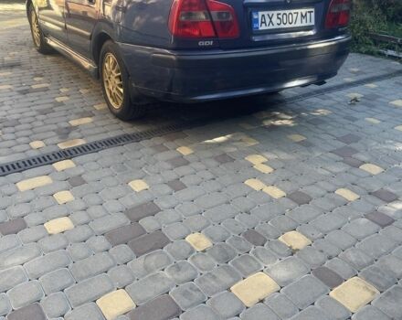 Синий Мицубиси Харизма, объемом двигателя 1.8 л и пробегом 250 тыс. км за 3000 $, фото 1 на Automoto.ua