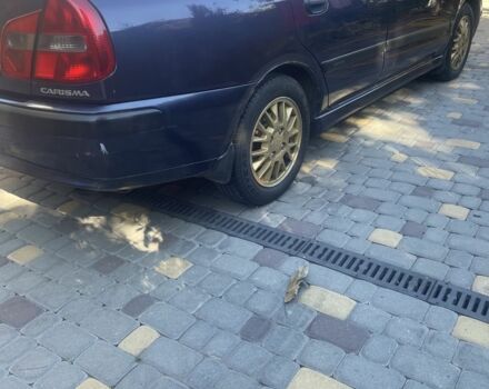 Синий Мицубиси Харизма, объемом двигателя 1.8 л и пробегом 250 тыс. км за 3000 $, фото 2 на Automoto.ua