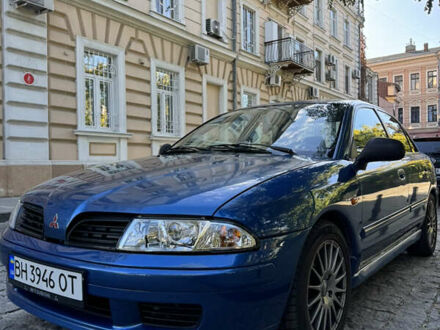 Синий Мицубиси Харизма, объемом двигателя 1.83 л и пробегом 303 тыс. км за 3000 $, фото 1 на Automoto.ua