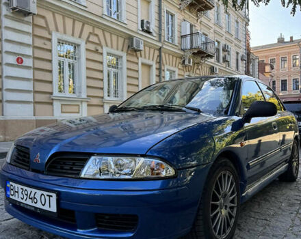 Синий Мицубиси Харизма, объемом двигателя 1.83 л и пробегом 303 тыс. км за 3000 $, фото 1 на Automoto.ua