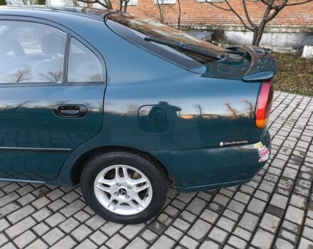 Зелений Міцубісі Харизма, об'ємом двигуна 1.6 л та пробігом 357 тис. км за 1499 $, фото 11 на Automoto.ua