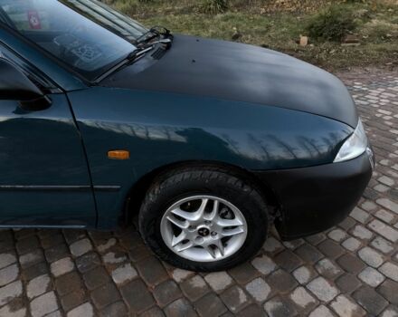 Зелений Міцубісі Харизма, об'ємом двигуна 1.6 л та пробігом 357 тис. км за 1499 $, фото 17 на Automoto.ua