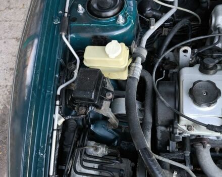 Зелений Міцубісі Харизма, об'ємом двигуна 1.6 л та пробігом 357 тис. км за 1499 $, фото 16 на Automoto.ua